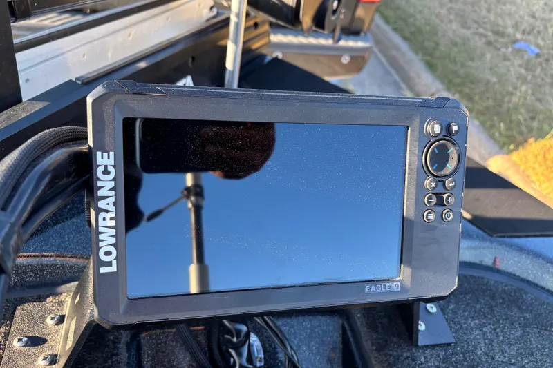 Slide: The Image of Close-up of a 2011 Skeeter ZX250 boat motor component on a sunny day. - 44