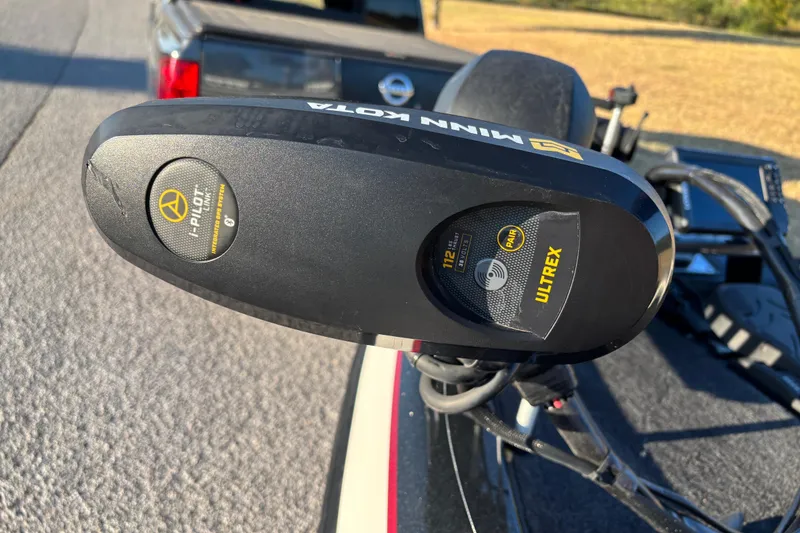 Slide: The Image of Open storage compartment in a 2011 Skeeter ZX250 boat, featuring carpeted interior. - 47