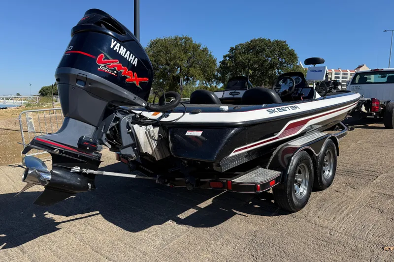 Slide: The Image of 2011 Skeeter ZX250 boat with Yamaha VMAX engine on a trailer. - 63