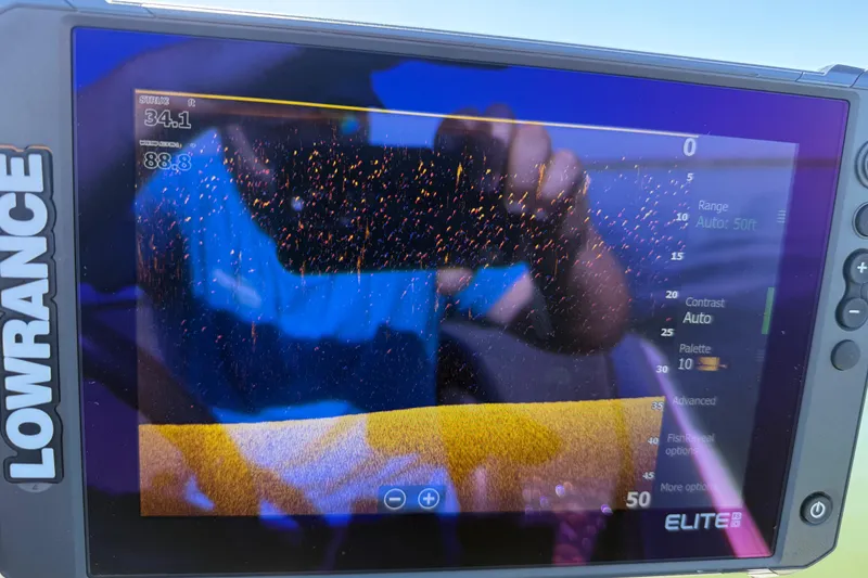 Slide: The Image of Lowrance Elite fishfinder display on 2011 Skeeter ZX250 boat, showing sonar data and settings. - 88
