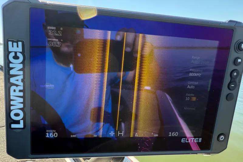 Slide: The Image of Lowrance fish finder display on 2011 Skeeter ZX250 boat, showing sonar data. - 91
