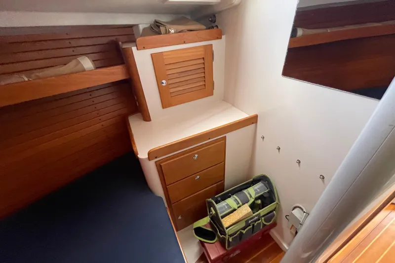 Slide: The Image of Interior cabin of 2001 J Boats J/32 with wooden cabinetry and storage. - 20