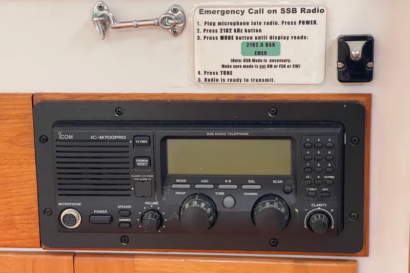 Slide: The Image of ICOM IC-M700PRO SSB radio on 2001 J Boats J/32, with emergency call instructions. - 24
