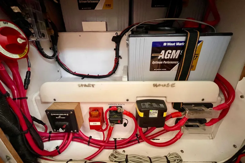 Slide: The Image of Electrical system of a 2001 J Boats J/32, featuring AGM battery and wiring. - 27