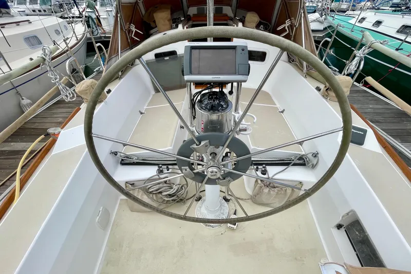 Slide: The Image of 2001 J Boats J/32 sailboat cockpit with steering wheel and navigation equipment. - 7