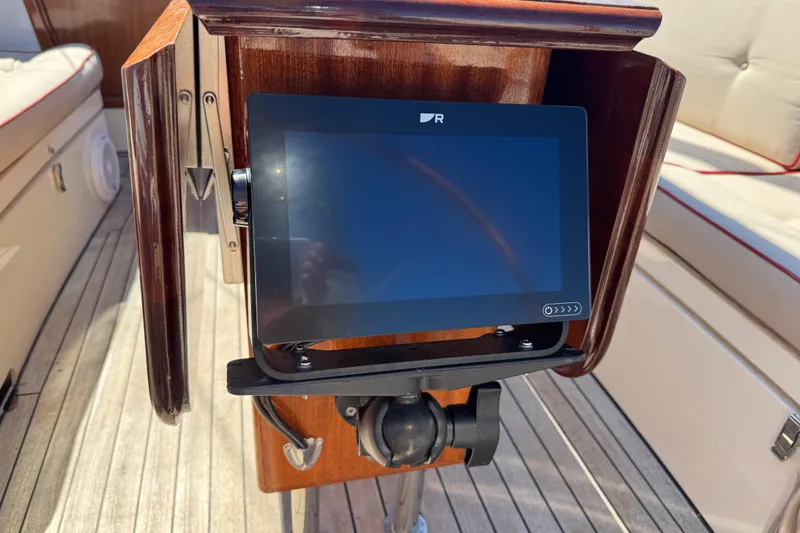 Slide: The Image of Touchscreen navigation panel on 2018 Leonardo Yachts Eagle 44 sailboat, wooden helm background. - 15