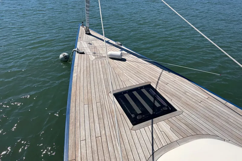 Slide: The Image of 2018 Leonardo Yachts Eagle 44 sailboat deck on calm water. - 3