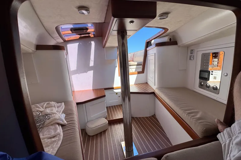 Slide: The Image of Interior of 2018 Leonardo Yachts Eagle 44, featuring elegant wood and beige upholstery. - 19
