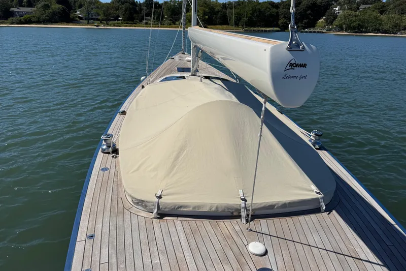 Slide: The Image of 2018 Leonardo Yachts Eagle 44 sailboat with covered deck, moored on calm water. - 7