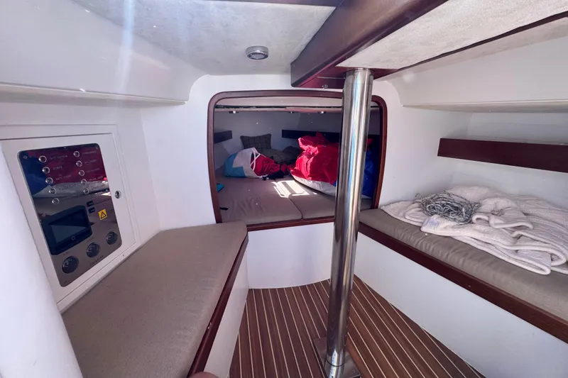 Slide: The Image of 2018 Leonardo Yachts Eagle 44 cabin interior with cozy bedding and control panel. - 17