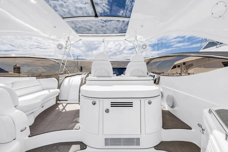 Slide: The Image of Luxurious 2002 Cruisers 5370 yacht interior with white seating and panoramic views. - 15