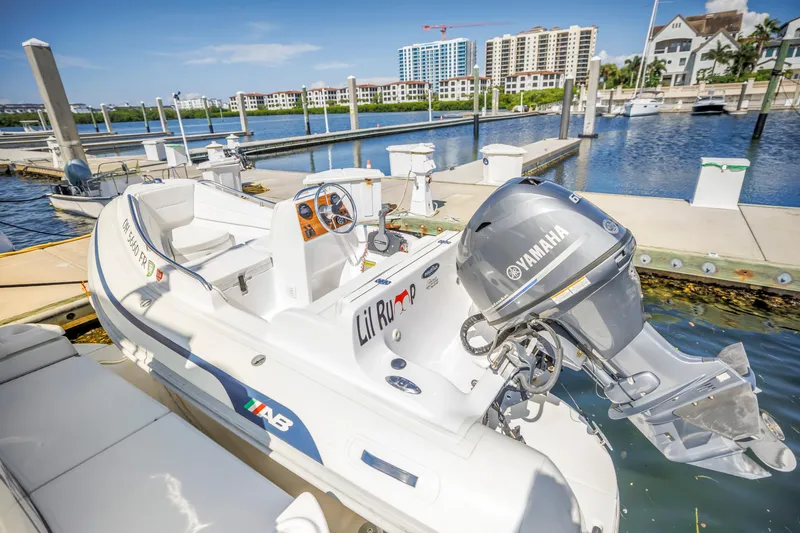 Slide: The Image of 2002 Cruisers 5370 boat docked with Yamaha engine in sunny marina setting. - 39