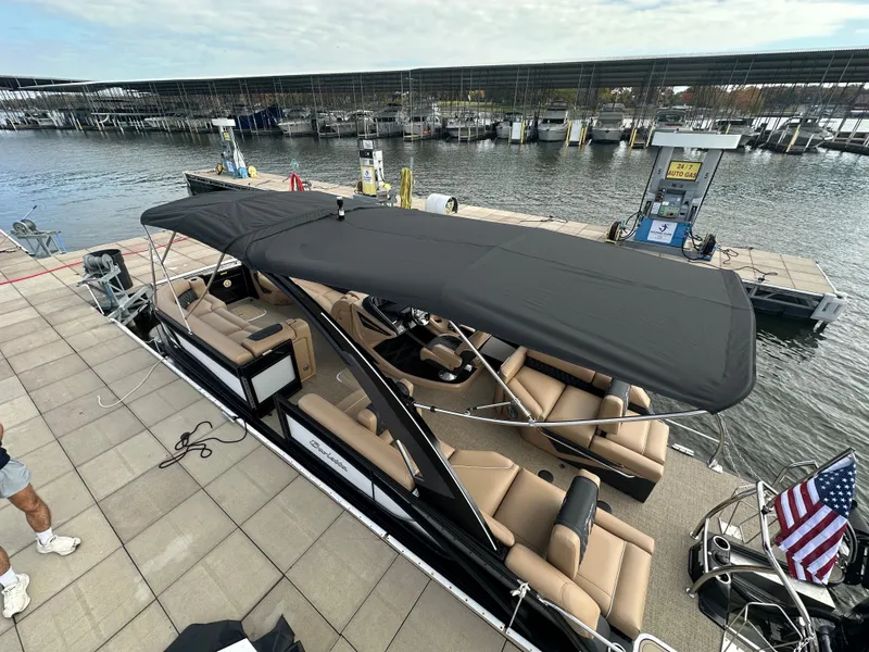 Slide: The Image of 2026 Barletta L25MA pontoon boat docked with canopy. - 45