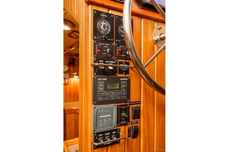 Slide: The Image of Control panel of a 2005 Cabo Rico 42 Pilot yacht with wooden finish and steering wheel. - 18