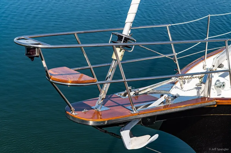 Slide: The Image of Bow of 2005 Cabo Rico 42 Pilot yacht with anchor and teak deck details. - 26