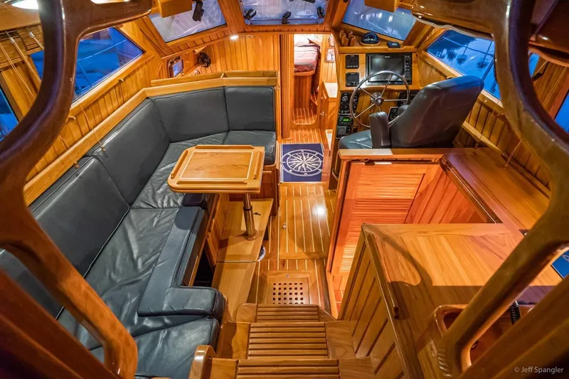Slide: The Image of Luxurious interior of 2005 Cabo Rico 42 Pilot yacht with wooden finishes and leather seating. - 3