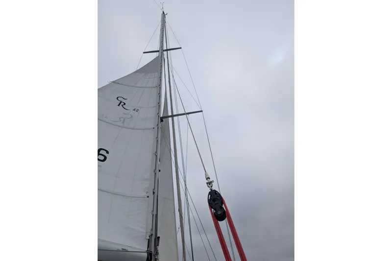 Slide: The Image of Sailboat mast and rigging of 2004 Cabo Rico 42 against cloudy sky. - 37
