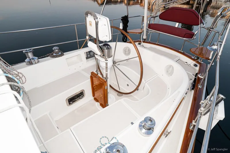 Slide: The Image of Cockpit of 2005 Cabo Rico 42 Pilot sailboat with wooden wheel and seating. - 5