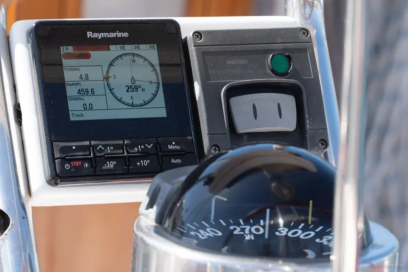 Slide: The Image of Navigation instruments on a 2005 Cabo Rico 42 Pilot sailboat, featuring Raymarine display and compass. - 8