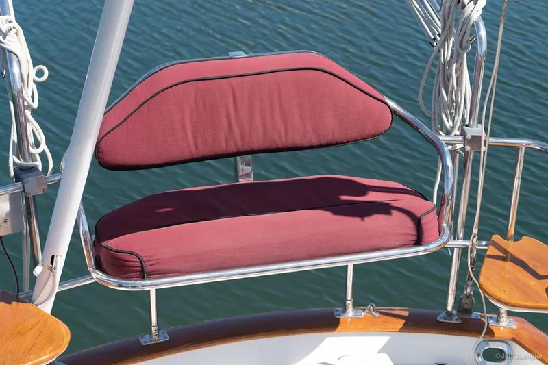 Slide: The Image of Cabo Rico 42 Pilot 2005 boat seat with maroon cushions, overlooking water. - 9