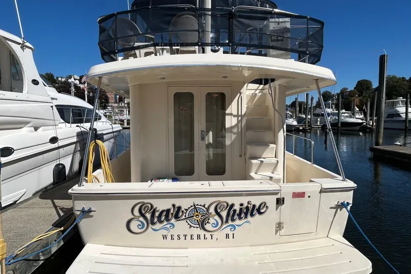 Slide: The Image of 2007 Mainship 34 Trawler docked, featuring "Star Shine" name and Westerly, RI location. - 4