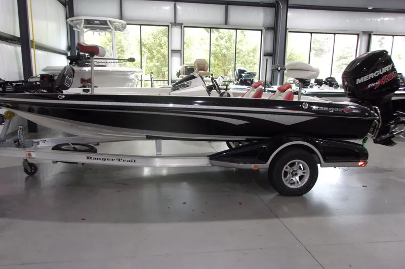 Slide: The Image of 2017 Ranger Z518 Intracoastal boat on trailer in showroom, side view. - 15