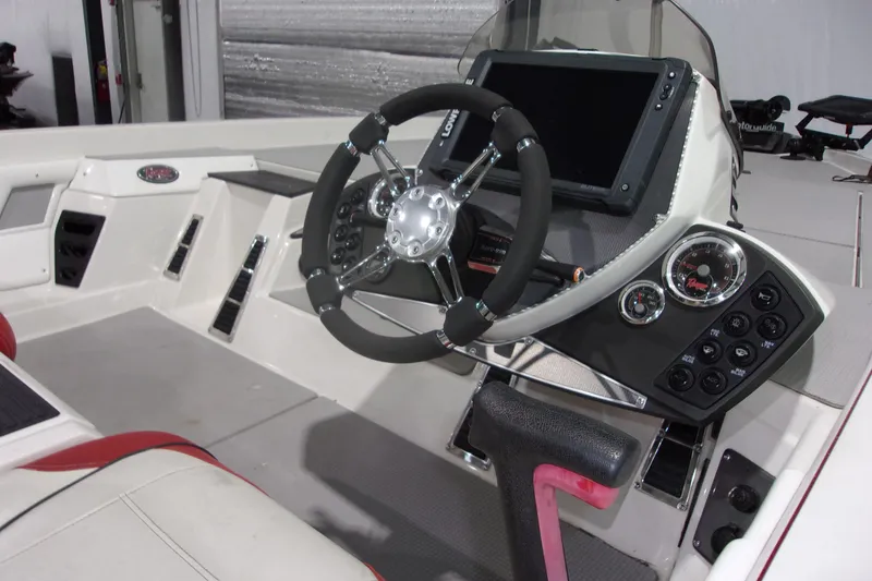 Slide: The Image of 2017 Ranger Z518 Intracoastal boat dashboard with steering wheel and control panel. - 5