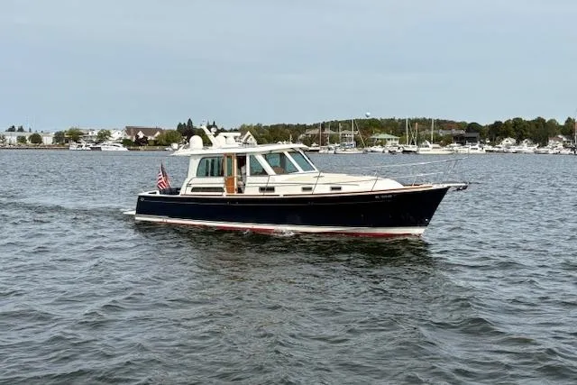 Slide: The Image of Interior of 2015 Sabre 42 Salon Express yacht with wooden flooring and helm chairs. - 11