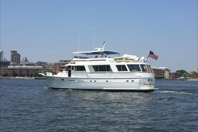 The Image of 1980 Hatteras 70 Motor Yacht cruising on open water, front view. - 0
