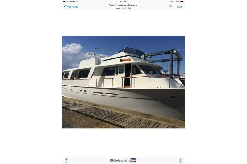 Slide: The Image of Kitchen interior of 1980 Hatteras 70 Motor Yacht with modern appliances and wooden cabinetry. - 11