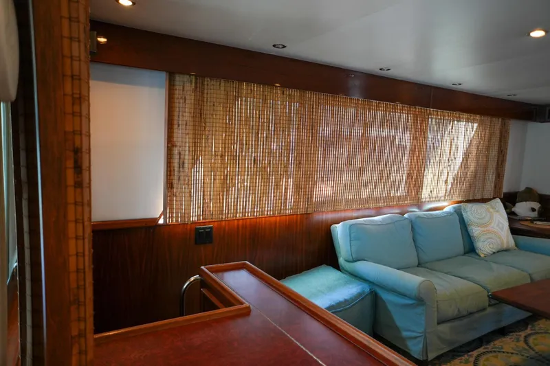 Slide: The Image of Bow view of 1980 Hatteras 70 Motor Yacht on calm waters. - 16