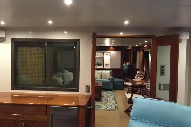 Slide: The Image of Interior kitchen of 1980 Hatteras 70 Motor Yacht with modern appliances and wooden cabinetry. - 8