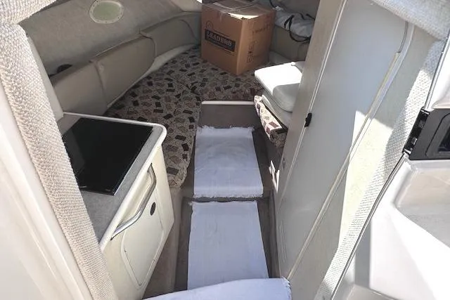 Slide: The Image of Interior of 2001 Sea Ray 245 Weekender boat with cabin and seating area. - 21