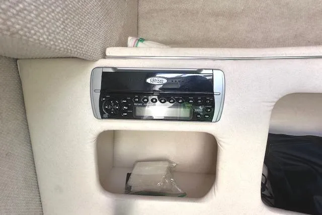 Slide: The Image of 2001 Sea Ray 245 Weekender cabin stereo system with storage compartments. - 27