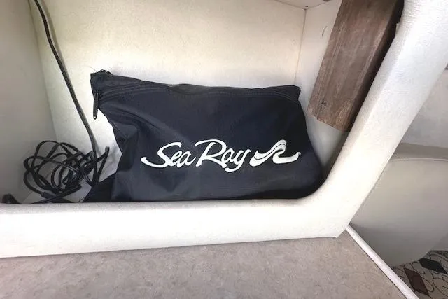 Slide: The Image of Black Sea Ray bag inside 2001 Sea Ray 245 Weekender boat cabin. - 28
