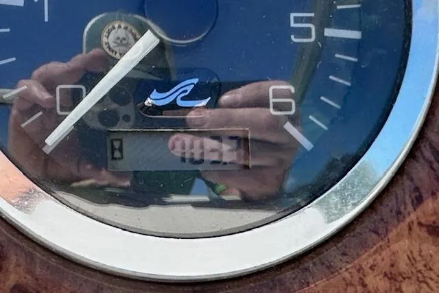 Slide: The Image of Close-up of a 2001 Sea Ray 245 Weekender boat gauge with reflection. - 36