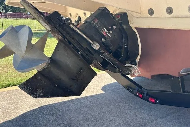 Slide: The Image of 2001 Sea Ray 245 Weekender boat propeller and stern drive detail. - 5