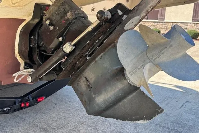 Slide: The Image of 2001 Sea Ray 245 Weekender boat propeller and stern drive close-up. - 6