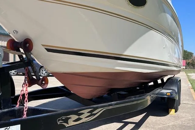 Slide: The Image of 2001 Sea Ray 245 Weekender boat on trailer, side view. - 7
