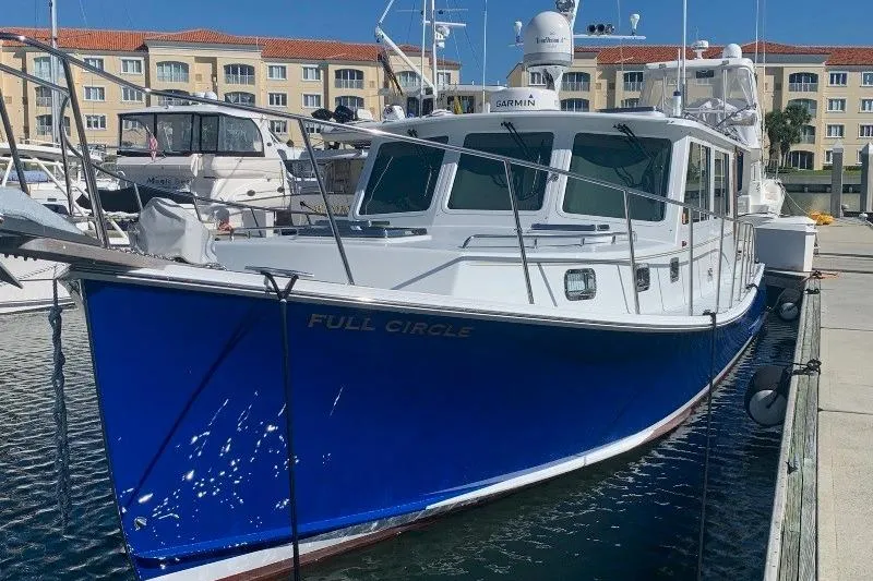 Slide: The Image of 2006 Duffy 37 Downeast boat named "Full Circle" docked at marina. - 10