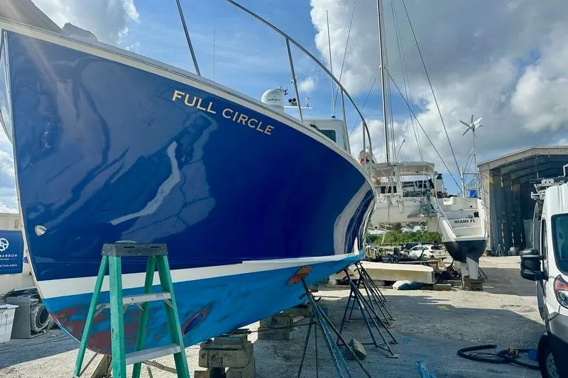 Slide: The Image of Blue 2006 Duffy 37 Downeast boat named "Full Circle" in a boatyard. - 16