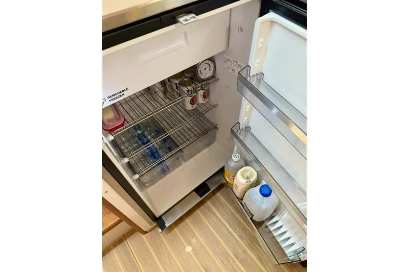 Slide: The Image of Open fridge inside 2006 Duffy 37 Downeast boat, stocked with drinks and condiments. - 20
