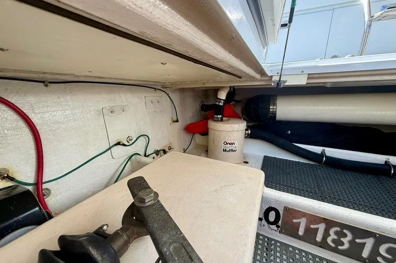 Slide: The Image of Engine compartment of 2006 Duffy 37 Downeast boat with Onan muffler and wiring. - 23