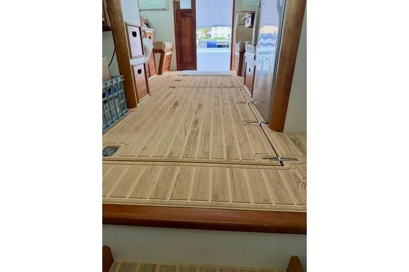 Slide: The Image of Interior view of 2006 Duffy 37 Downeast boat with wooden flooring and cabinetry. - 29