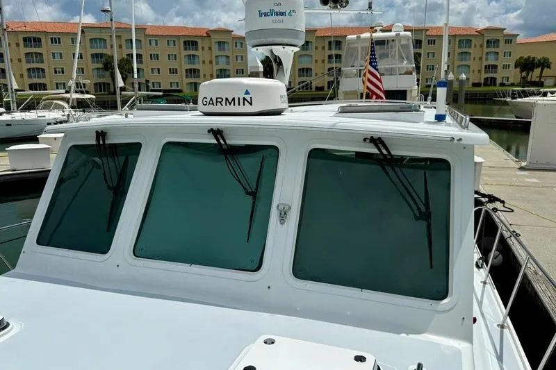 Slide: The Image of 2006 Duffy 37 Downeast boat with Garmin equipment docked at marina. - 33