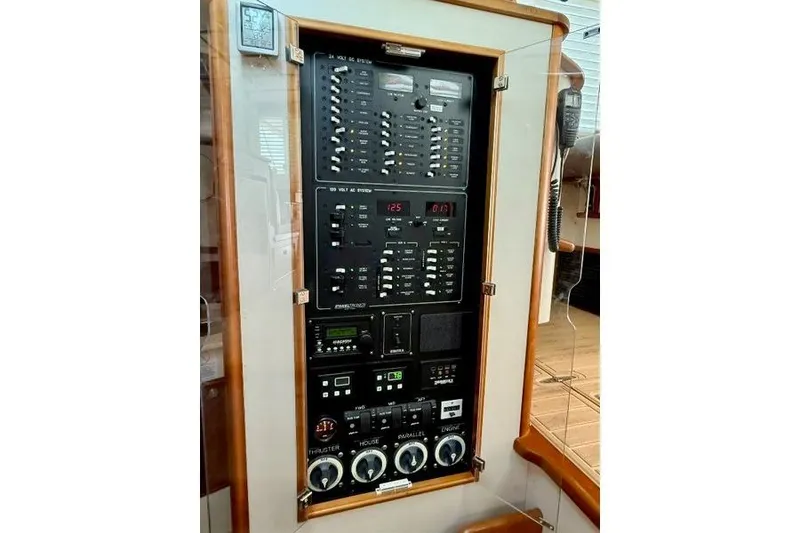 Slide: The Image of Electrical control panel on a 2006 Duffy 37 Downeast boat, featuring various switches and gauges. - 42