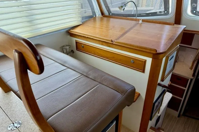 Slide: The Image of Interior of 2006 Duffy 37 Downeast boat with wooden cabinetry and leather seating. - 46