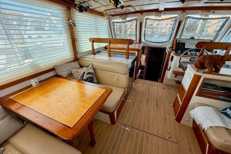 Slide: The Image of Interior of 2006 Duffy 37 Downeast boat with wood accents and seating area. - 48