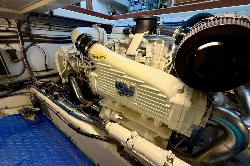 Slide: The Image of Engine room of a 2006 Duffy 37 Downeast boat, showcasing a powerful marine engine. - 56