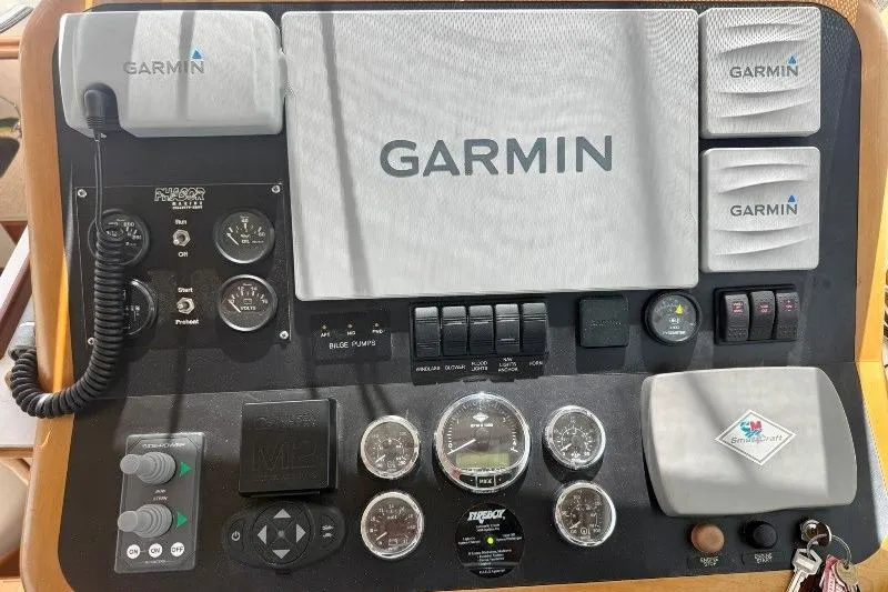 Slide: The Image of Control panel of a 2006 Duffy 37 Downeast boat with Garmin navigation equipment. - 57